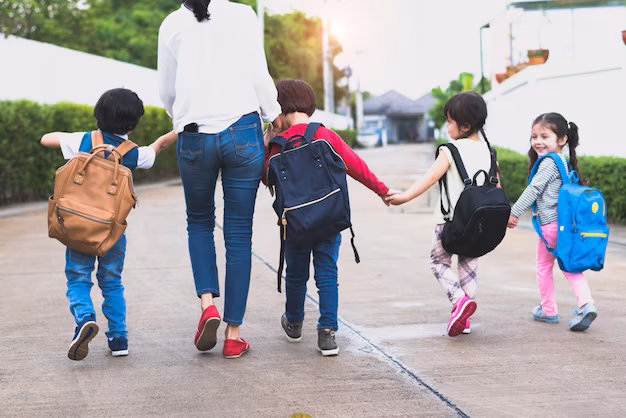 busy parent bringing kids to school